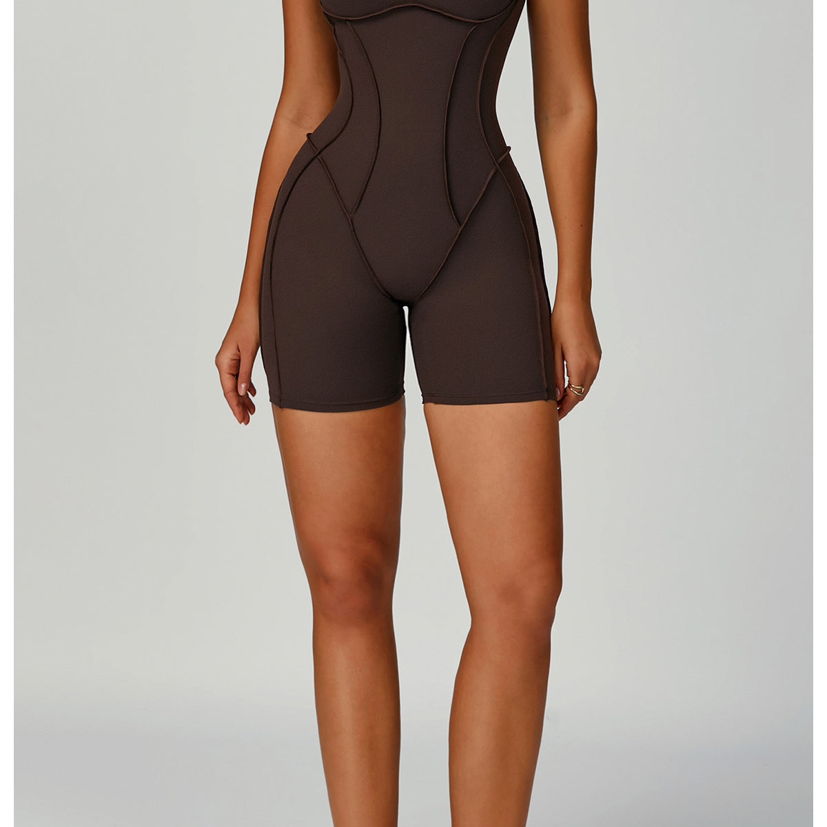 Langry brown seamless yoga jumpsuit with white sneakers and black laces