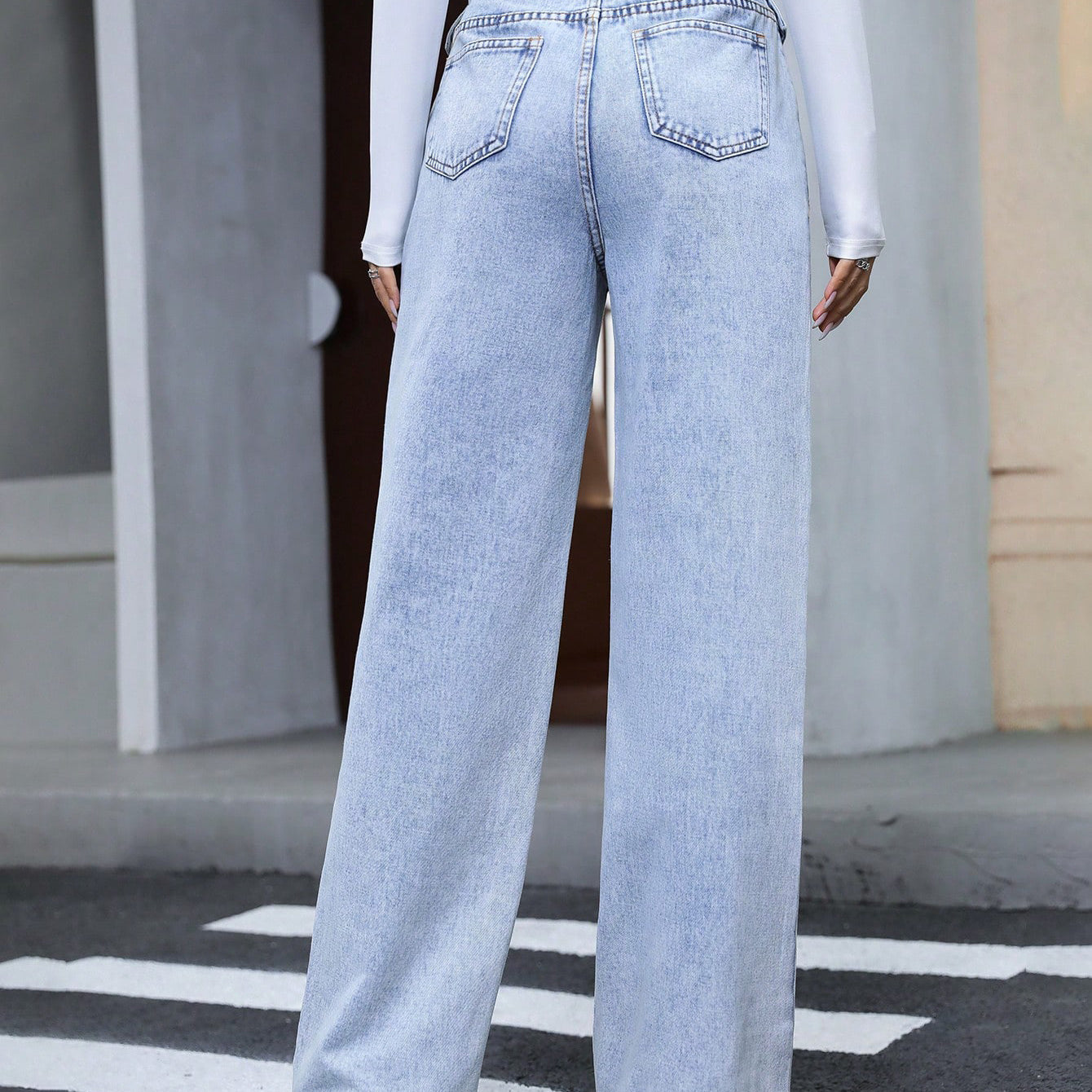 Light blue high-waisted wide-leg denim trousers with distressed wash for fashionable langry style