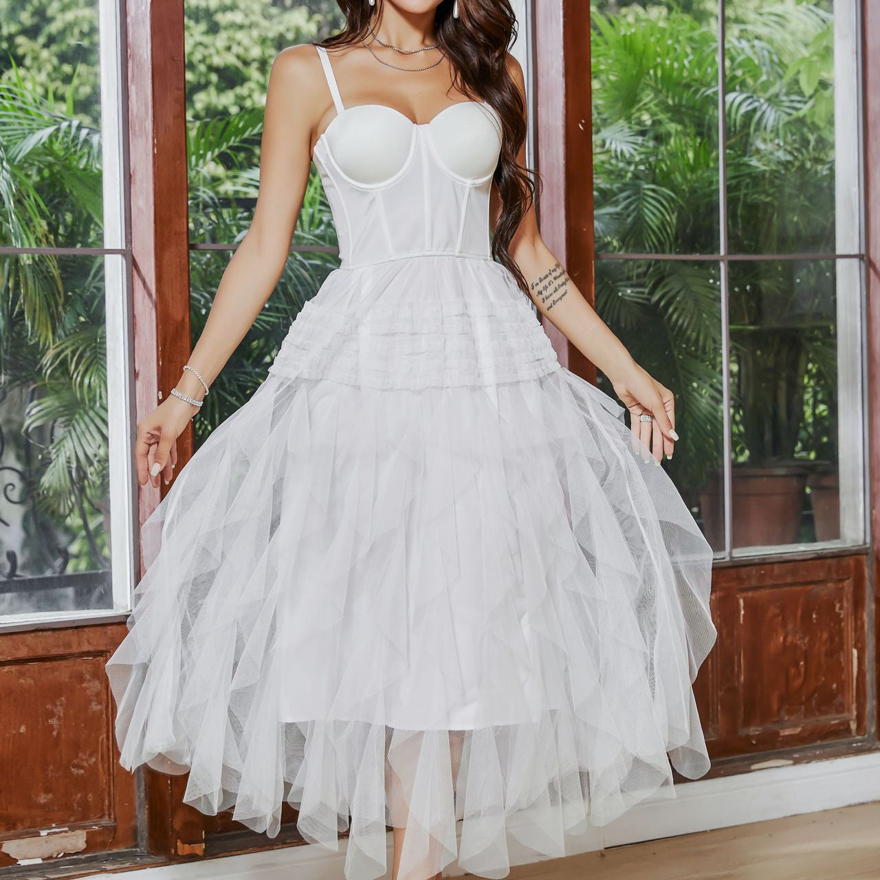 White tiered tulle dress featuring a French Tube top and large swing design