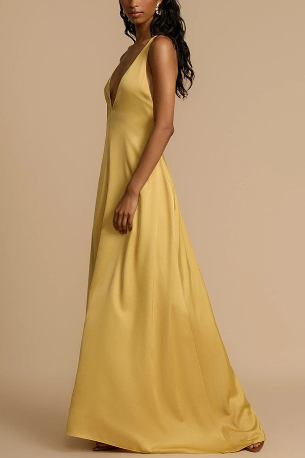 Elegant mustard-yellow satin maxi dress showcasing luxury fashion and sophisticated style