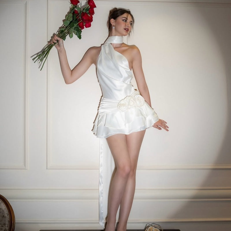 Woman in elegant high grade off shoulder dress holding red roses in fashion setting