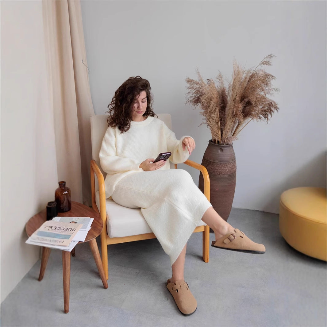 Woman in a white sweater dress showcasing Elegant Design Cardigan Knitted Skirt Sets fashion