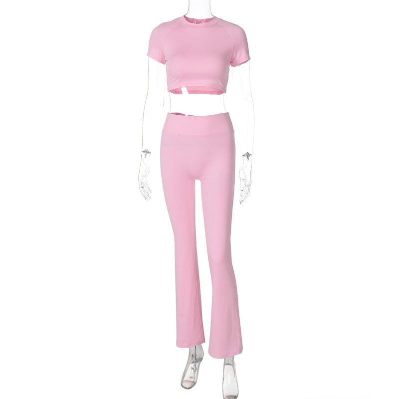 Pink crop top and flared pants set in slim fit high waist style for fashionable high waist suit look