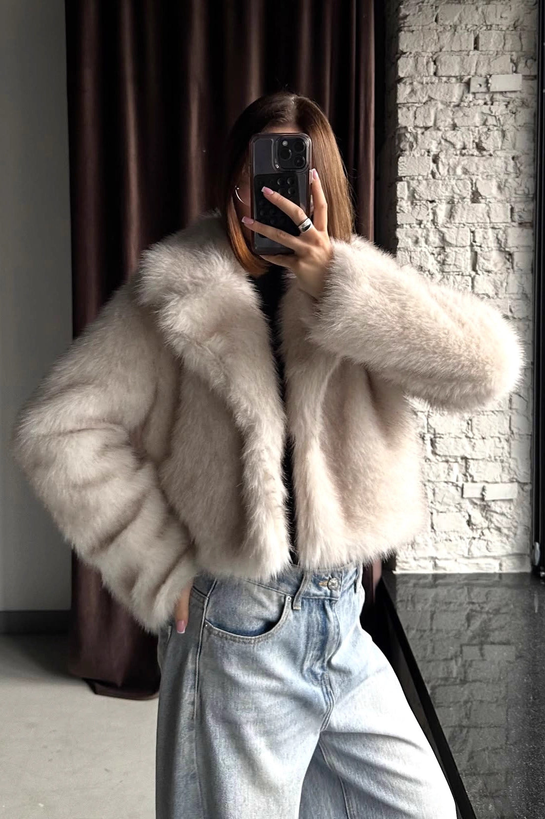 Warm faux fur baggy coat in light beige plush texture with cozy sleeves