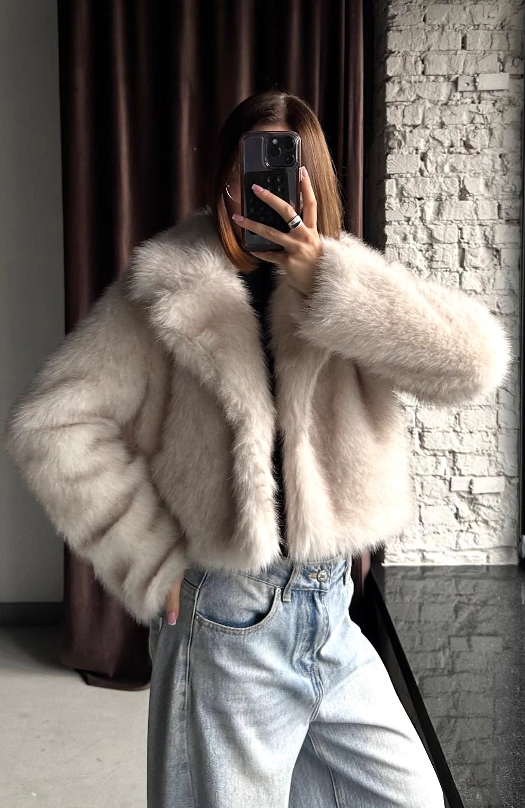 Warm faux fur baggy coat in light beige plush texture with cozy sleeves