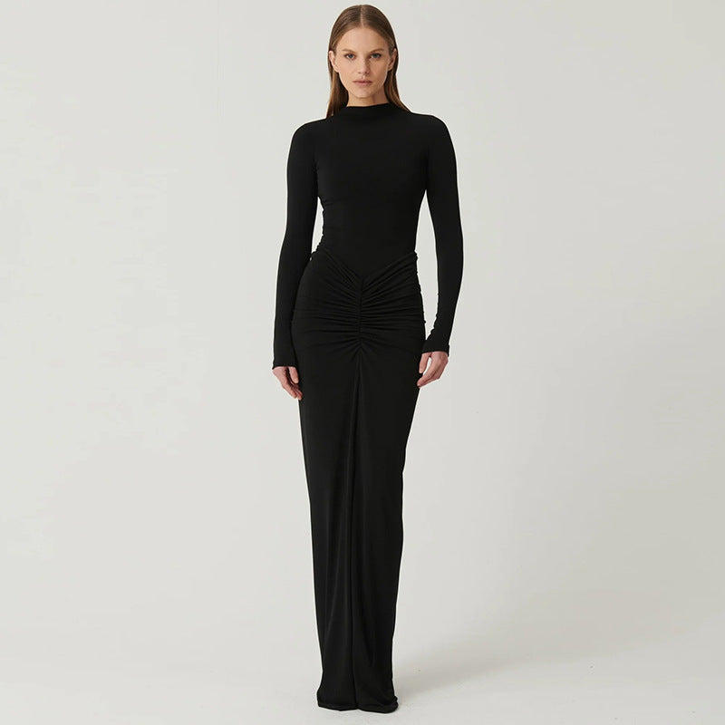 Elegant slimming black maxi dress with long sleeves showcasing stylish fashion