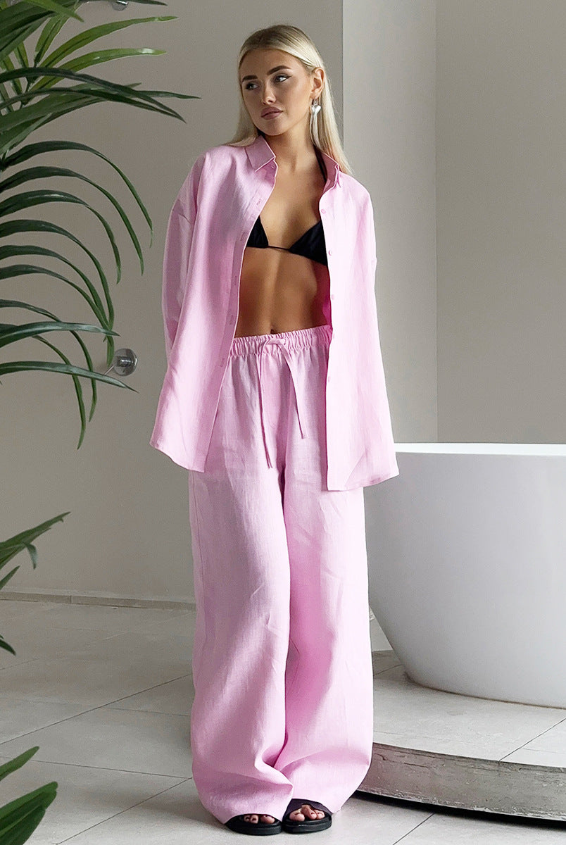 Woman wearing pink linen pajama set from Cotton Shirt Trousers Casual Sets, a stylish ملابس