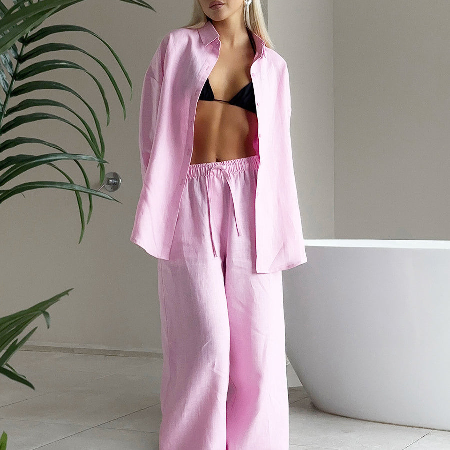 Woman wearing pink linen pajama set from Cotton Shirt Trousers Casual Sets, a stylish ملابس