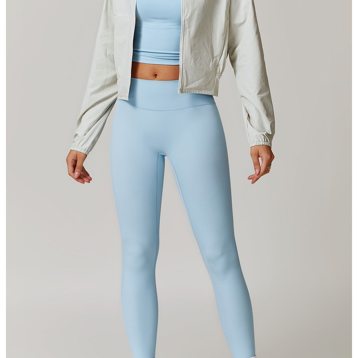 Athletic outfit with light blue crop top, leggings, and Quick Drying Stand Collar Sports Jacket