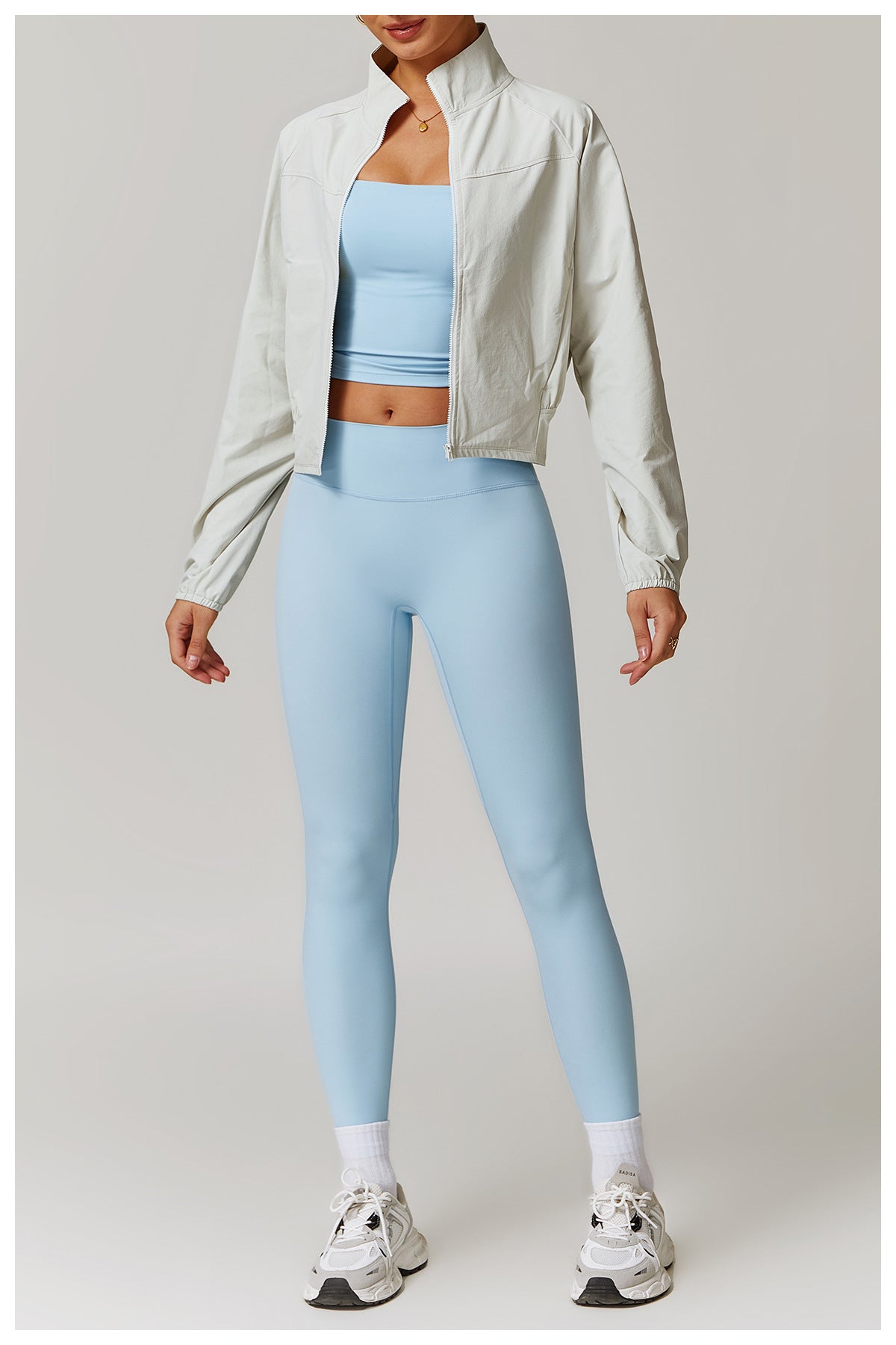 Athletic outfit with light blue crop top, leggings, and Quick Drying Stand Collar Sports Jacket