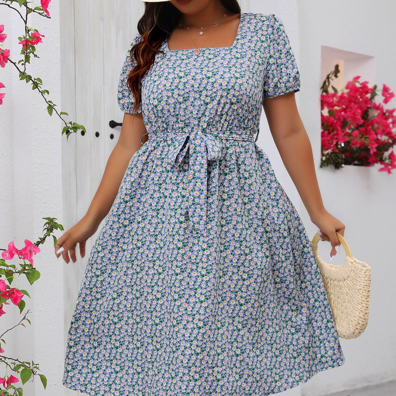 Light blue floral summer dress with square neck, puff sleeves, and tie waist