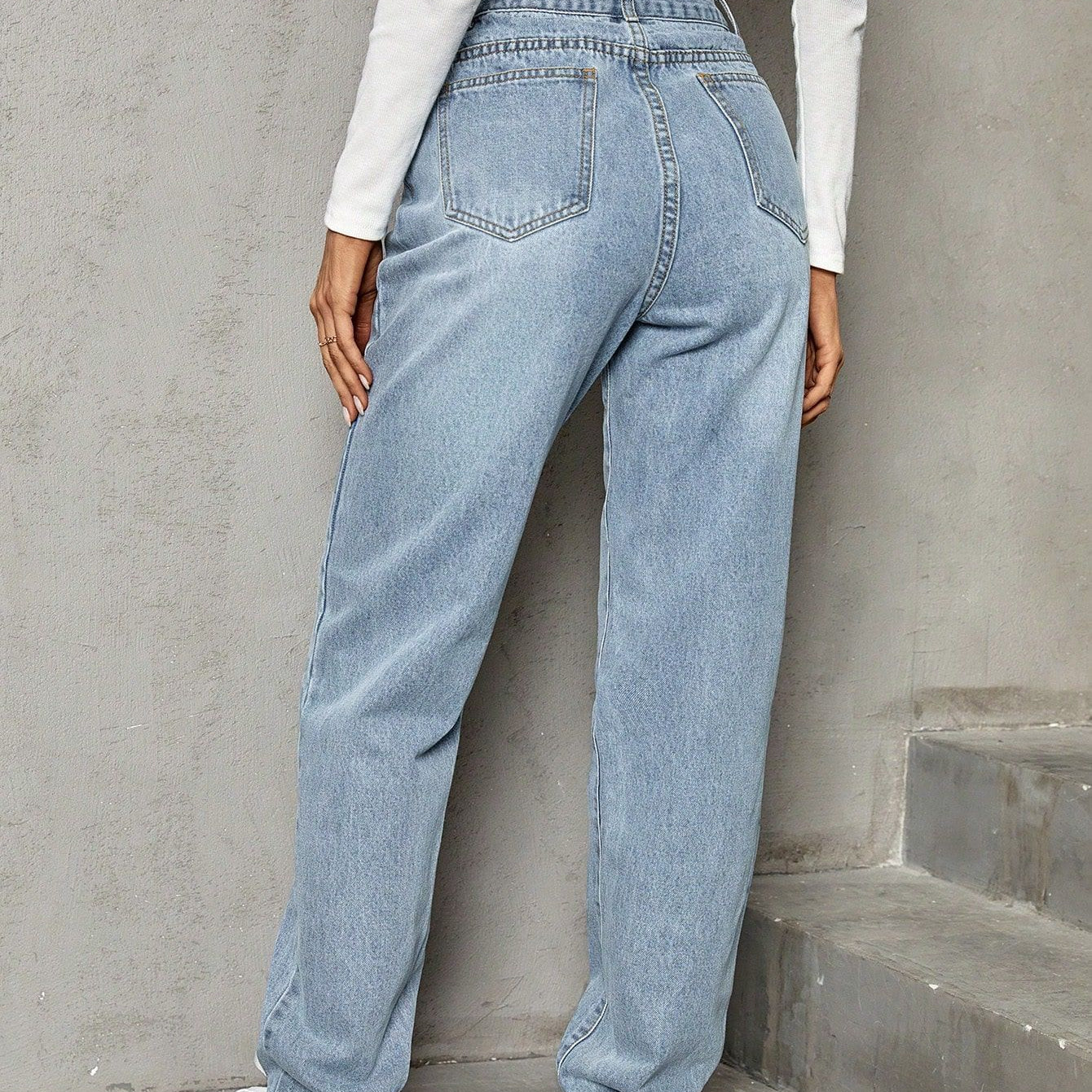 Light wash blue high-waisted baggy jeans with straight leg, elastic slimming denim trousers