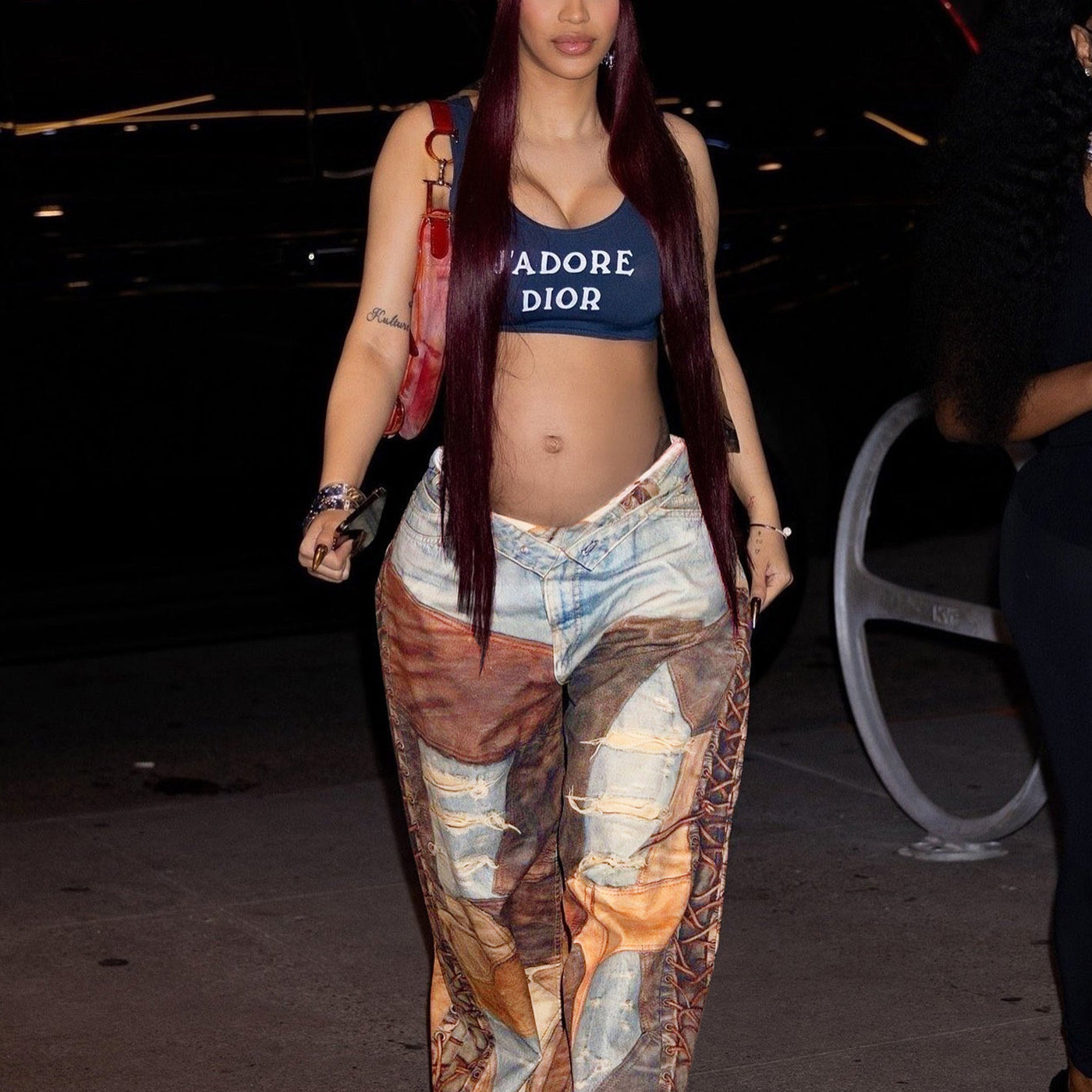 Person in Dior crop top and patterned wide-leg pants showcasing casual street style fashion