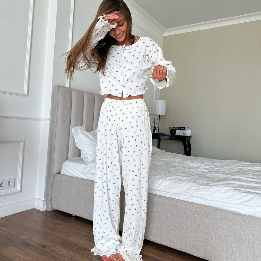 White two-piece pajama set with dark pattern, stylish homewear, and ملابس for women