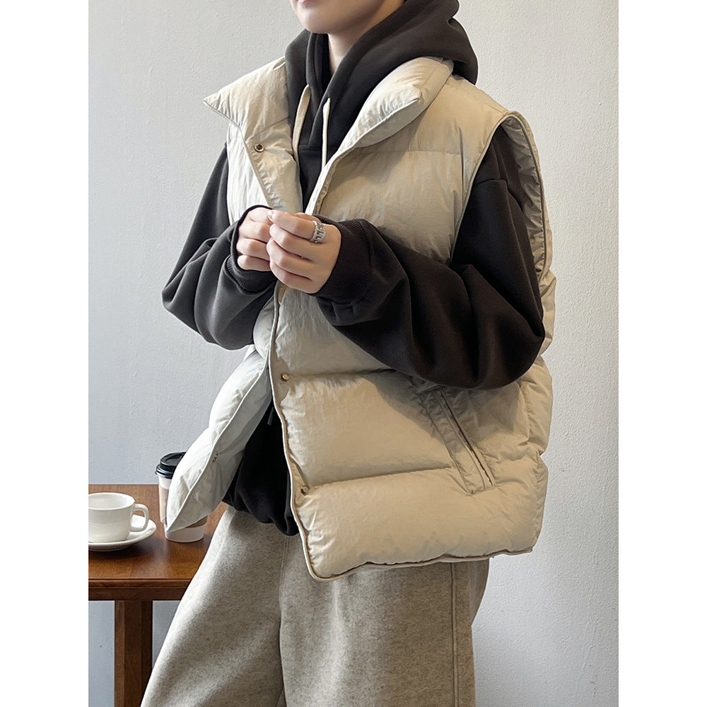 Cream-colored puffer vest over black hoodie showcasing Langry fashion ملابس style