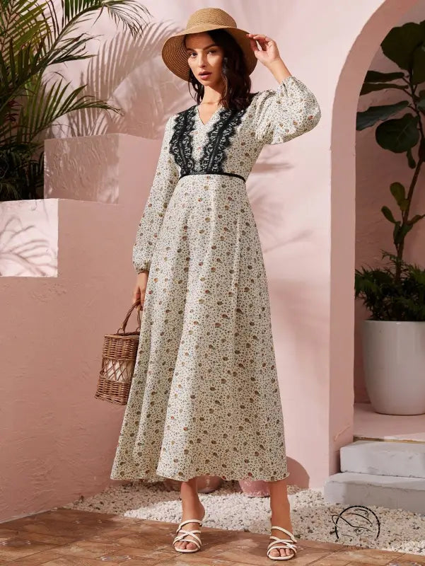 Elegant langry fashion dress with floral lace trim in beige tones