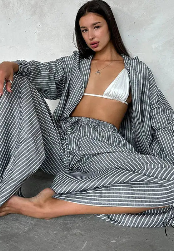 Woman in langry gray white striped wide-leg pajama set