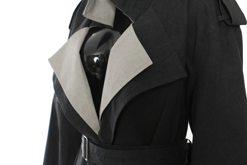 Casual langry fashion trench coat in black with white accents and belt