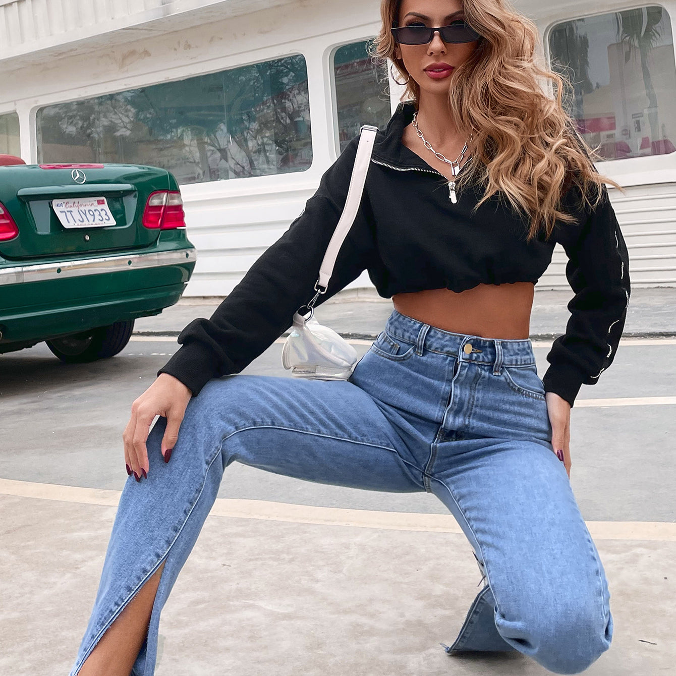 Young woman wearing Casual All-Match High Waist Denim Pants with split hems and white sneakers