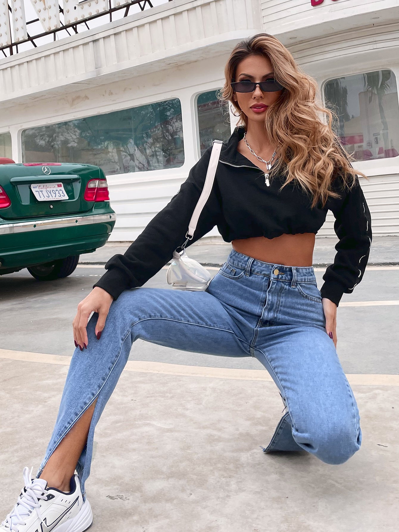 Young woman wearing Casual All-Match High Waist Denim Pants with split hems and white sneakers