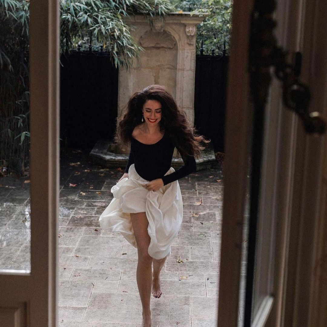 Barefoot dancer in Elegant Hepburn Dress exemplifying langry fashion with joy