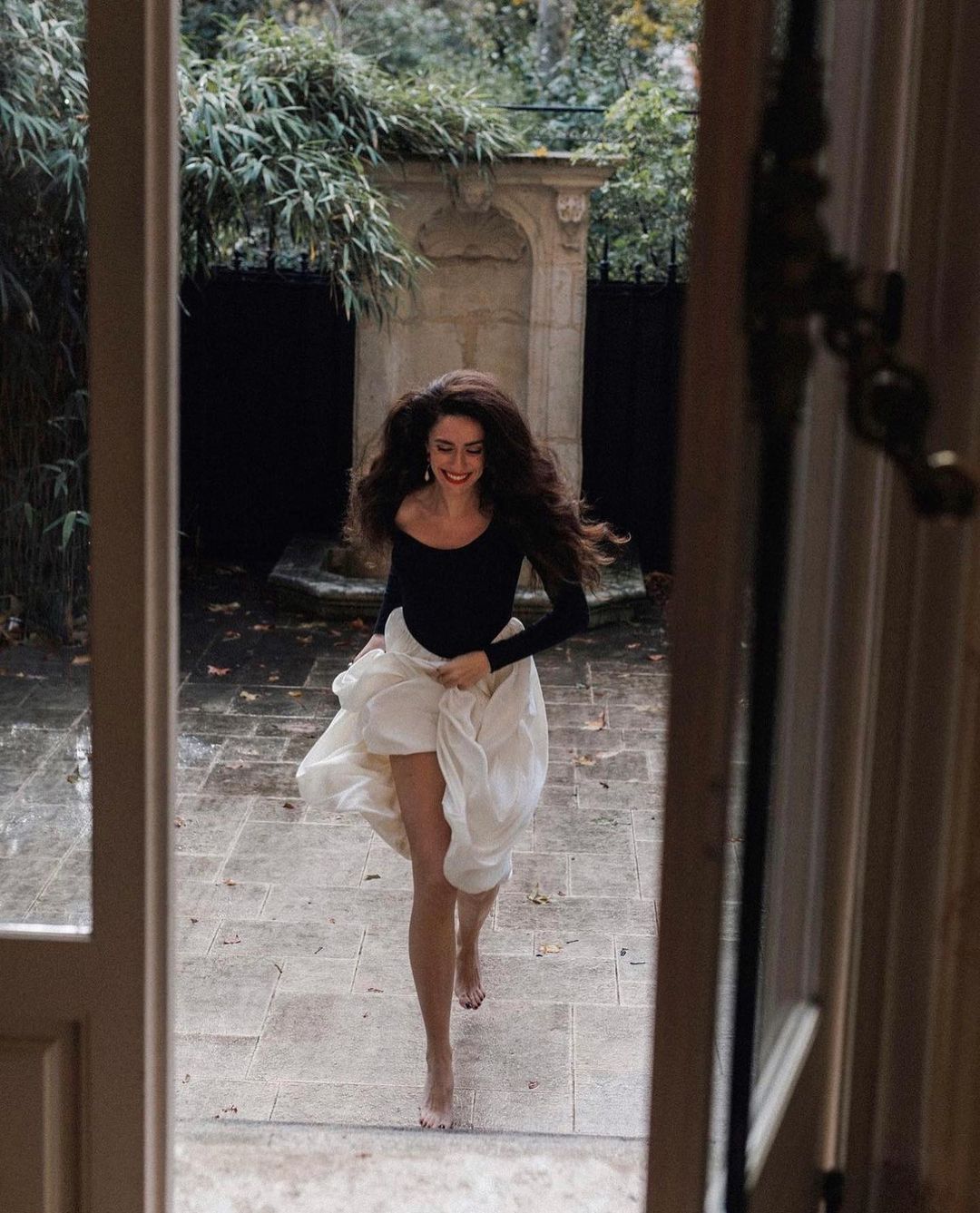 Barefoot dancer in Elegant Hepburn Dress exemplifying langry fashion with joy