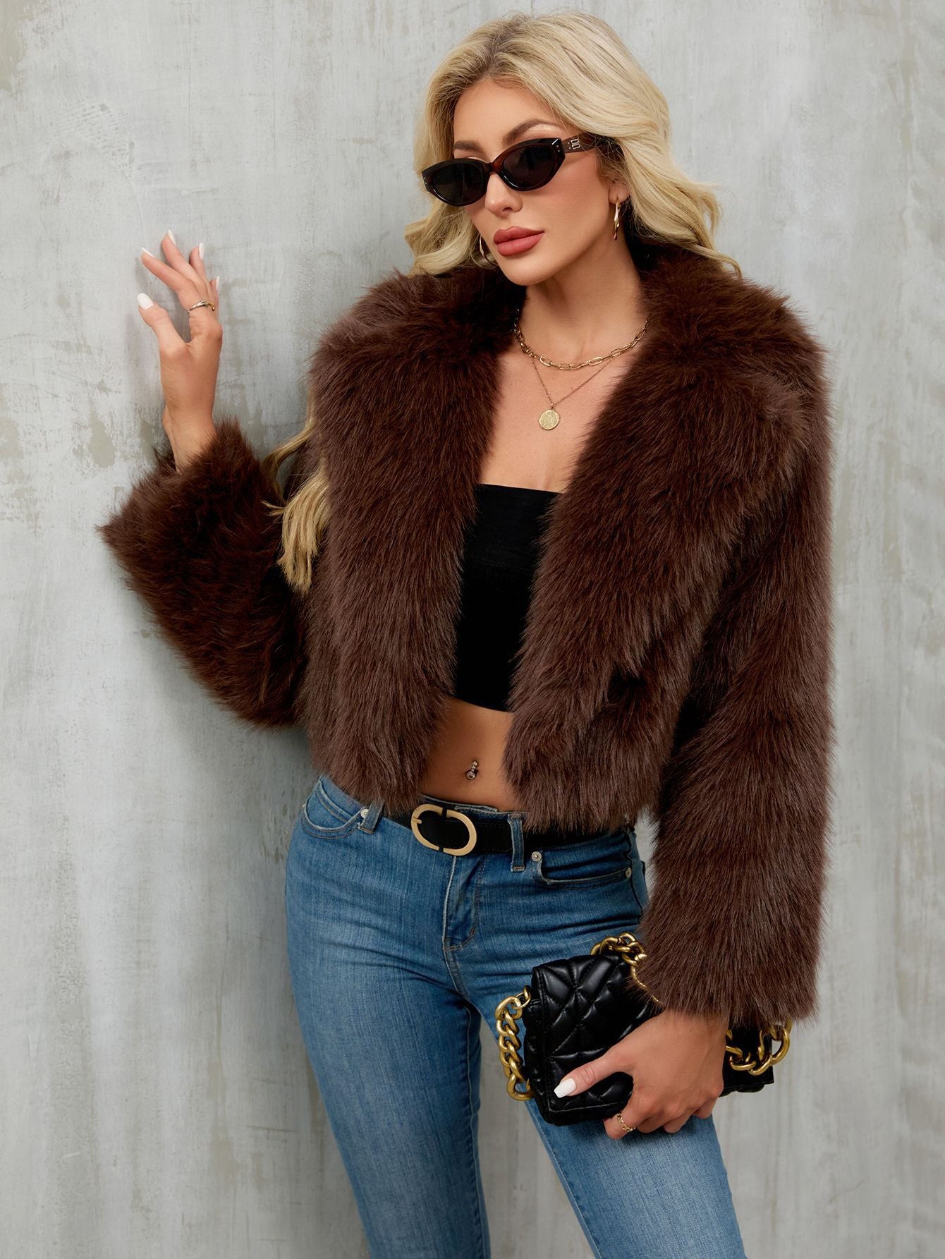 Brown faux fur cropped jacket with plush texture and long sleeves