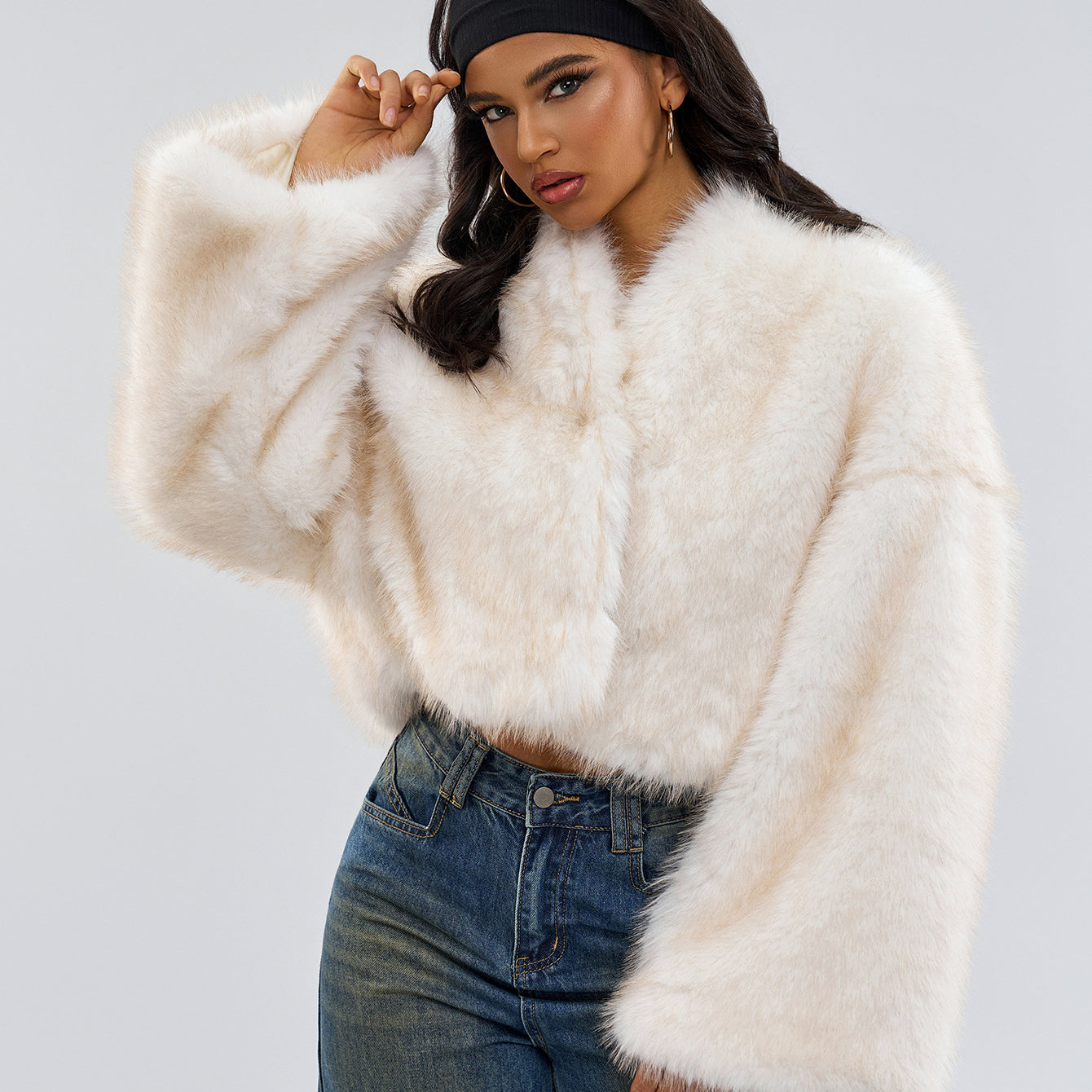 Woman in a trendy cropped faux fur jacket showcasing fashionable ملابس and langry style
