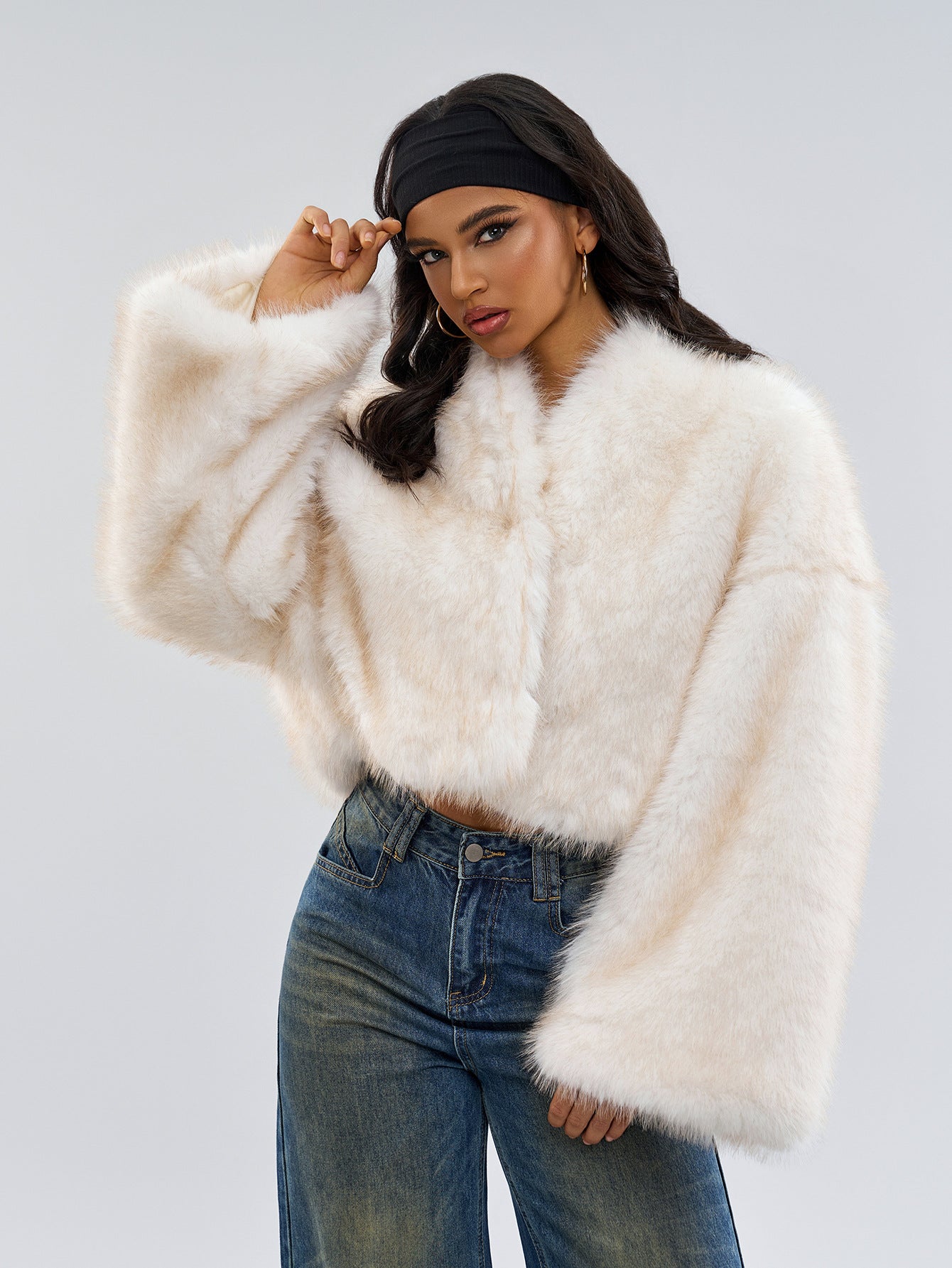 Woman in a trendy cropped faux fur jacket showcasing fashionable ملابس and langry style