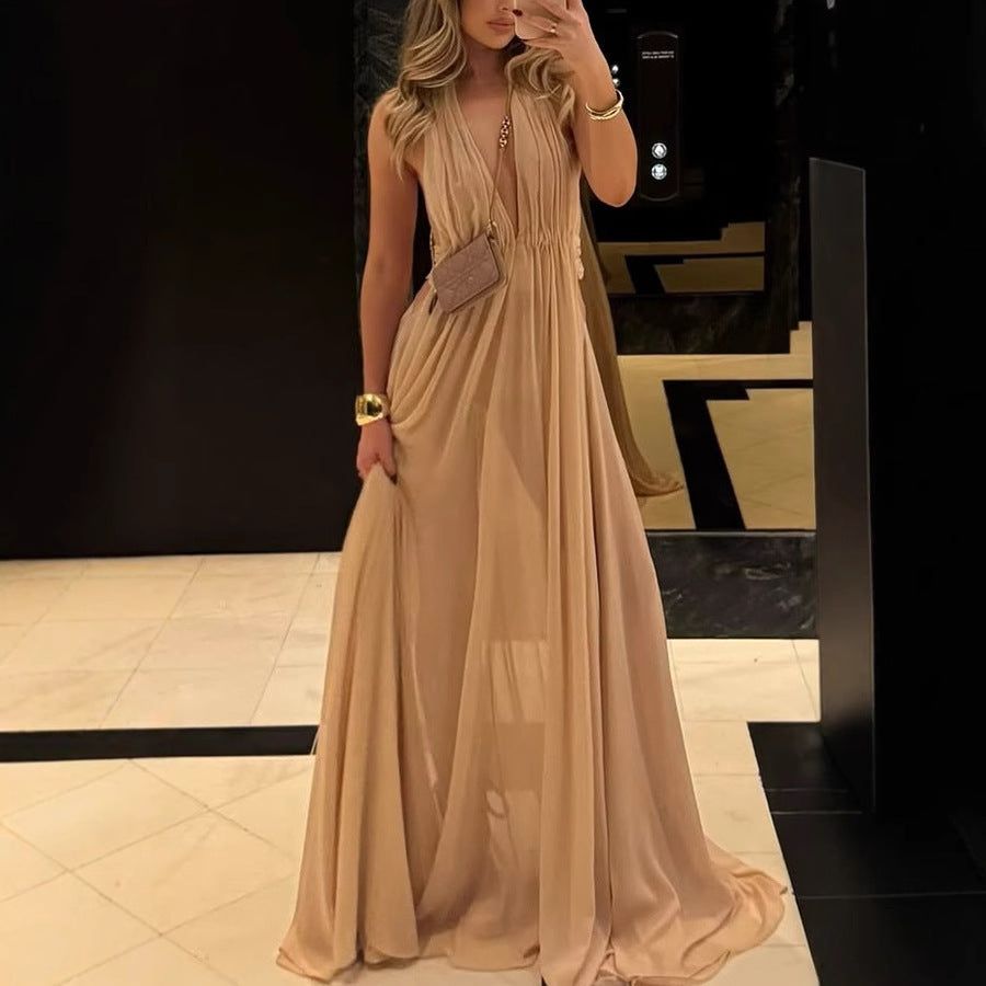 Elegant beige flowing maxi dress from Enchanting Long Evening Dress collection showcasing luxurious fashion and ملابس
