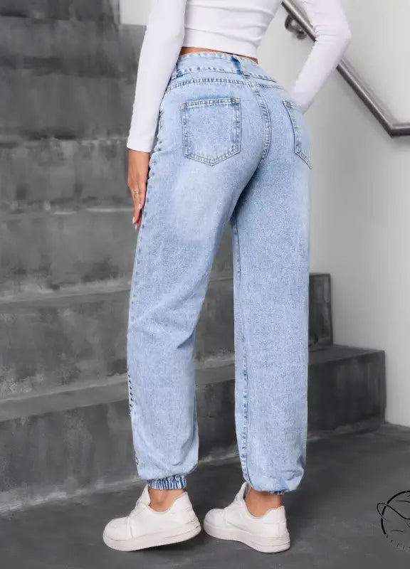Light-wash blue match beaded straight jeans with elastic cuffs