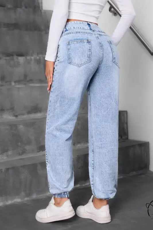 Light-wash blue match beaded straight jeans with elastic cuffs
