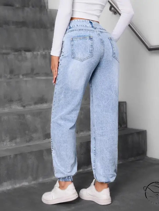 Light-wash blue match beaded straight jeans with elastic cuffs