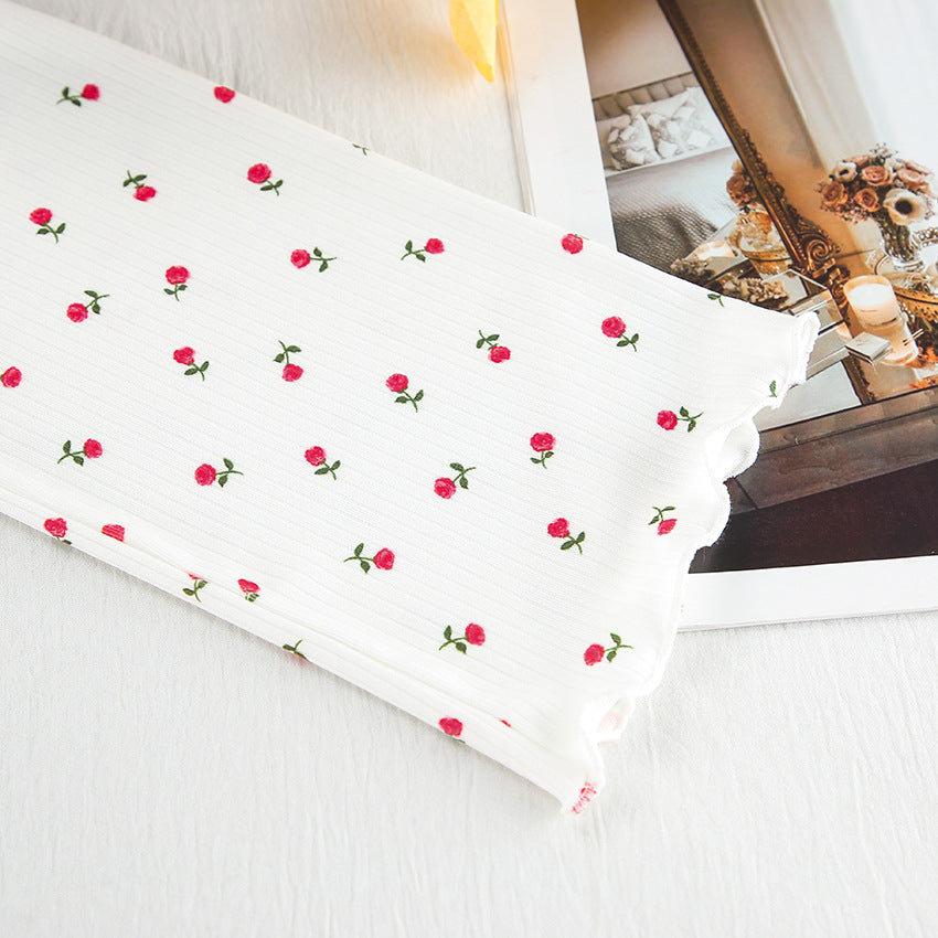 White fabric with red rose and green stem pattern, scalloped edge, stylish fashion ملابس
