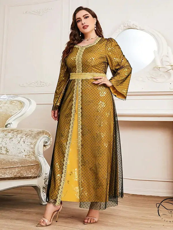 Woman in gold yellow Moroccan long sleeve A-line dress with lace trim