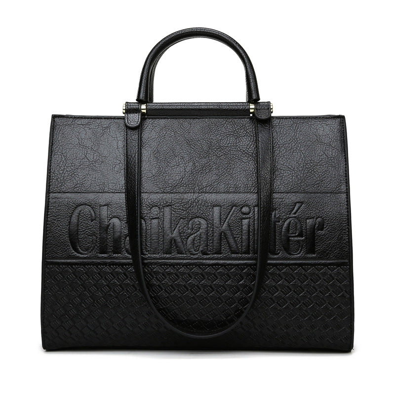 Elegant Large Capacity Handbag in black leather with embossed text and structured design