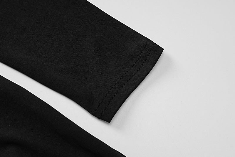 Black fabric sleeve of the Backless Long Sleeves Bell Bottom Pants Slim Fit Jumpsuit