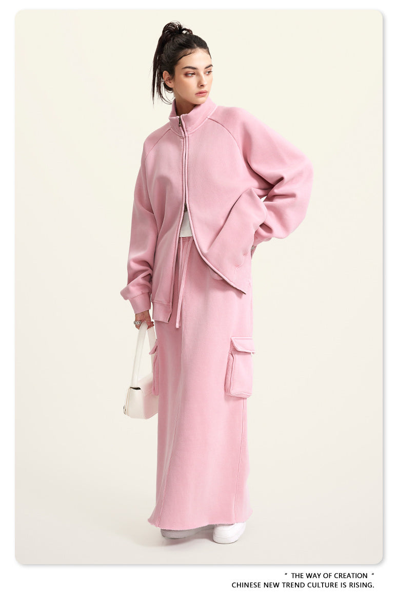 Pink zip-up jacket and matching maxi skirt ensemble with cargo pockets for trendy winter fashion