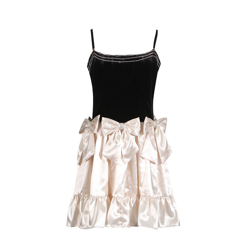 Black velvet and cream satin party dress with ruffles and bow details for luxury fashion