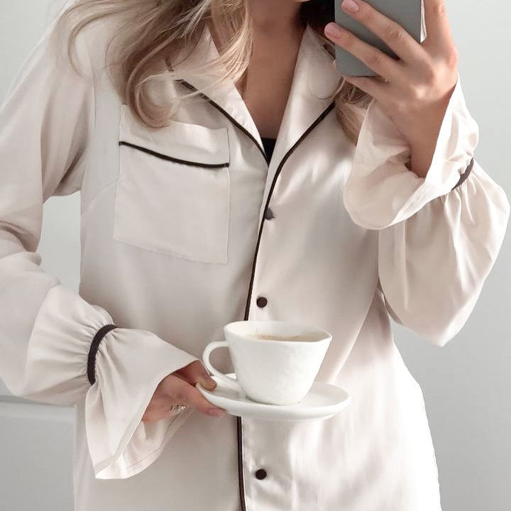 Langry white silk pajama set with black piping and buttons