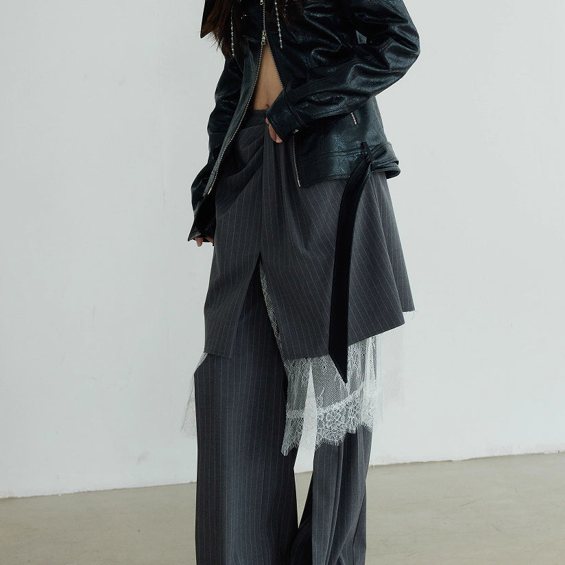 Casual pants suit featuring grey wide-leg pants with white lace detailing and a black leather jacket