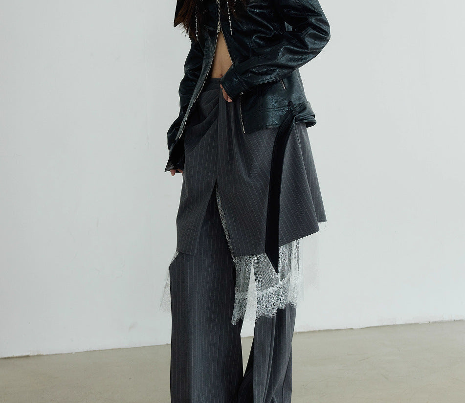 Casual pants suit featuring grey wide-leg pants with white lace detailing and a black leather jacket
