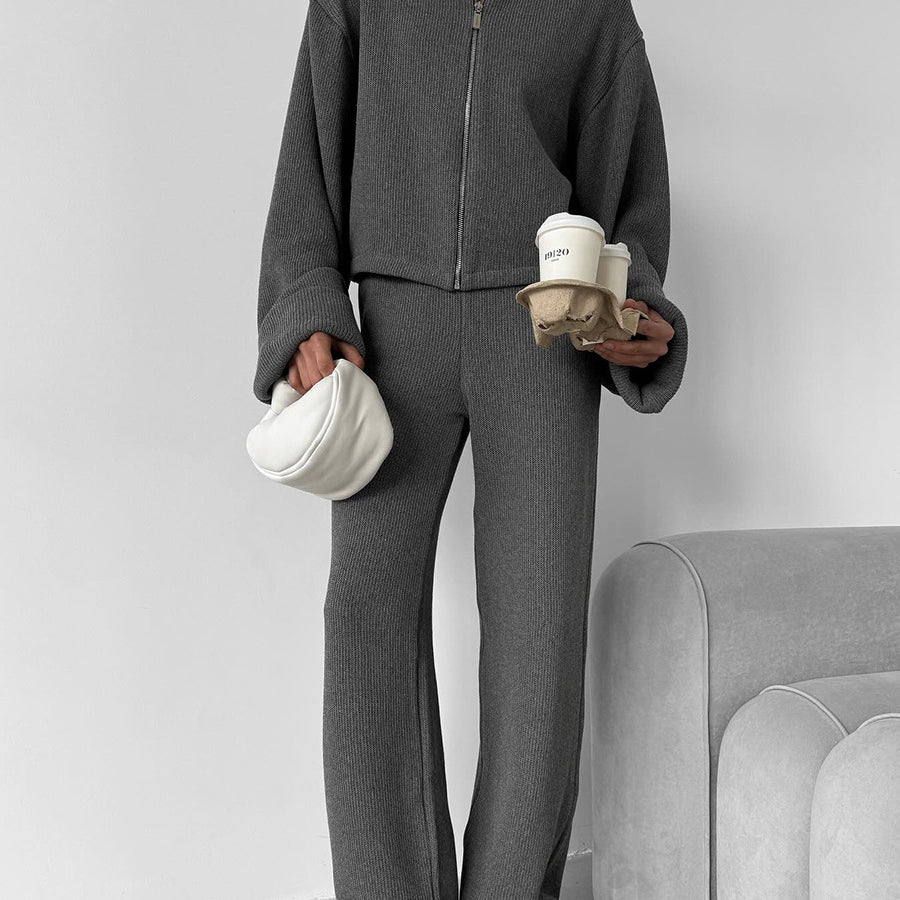 Elegant langry fashion ملابس: grey zip-up jacket with wide-leg trousers and white bag