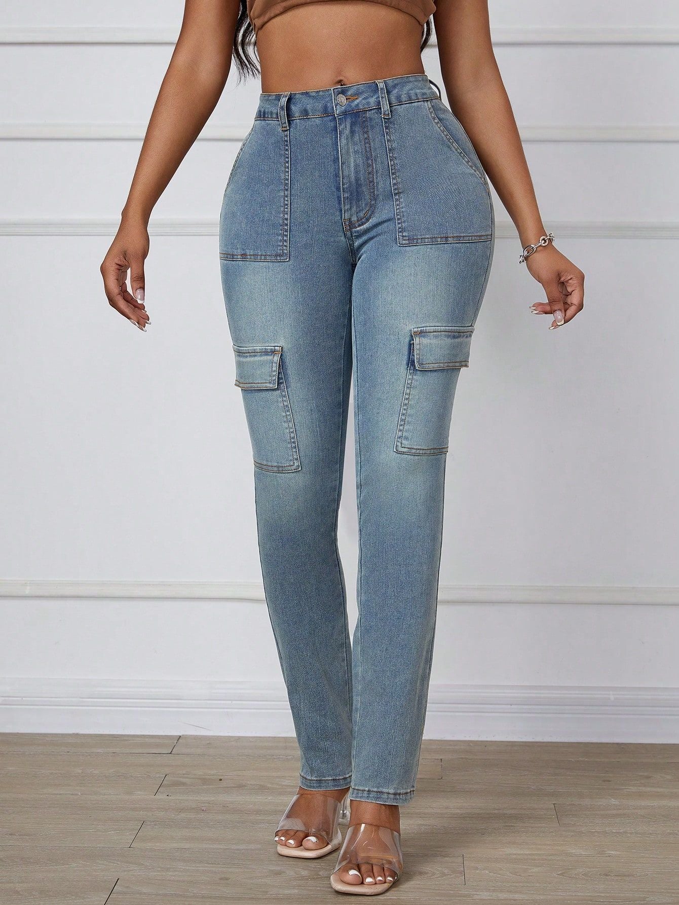 Light-wash denim cargo pants with large side pockets, ideal as straight skinny jeans