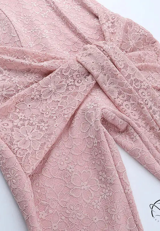 Elegant pink lace wrap dress with floral pattern and tie waist in langry fashion