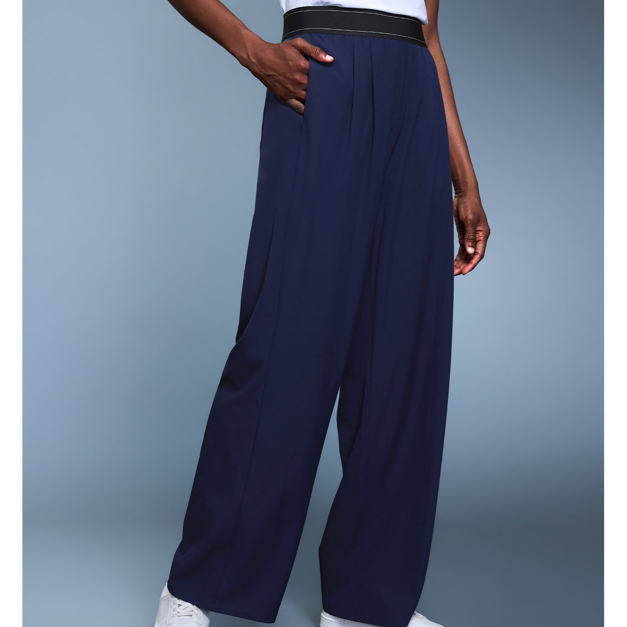 Navy blue langry fashion wide-leg trousers with black waistband and white sneakers