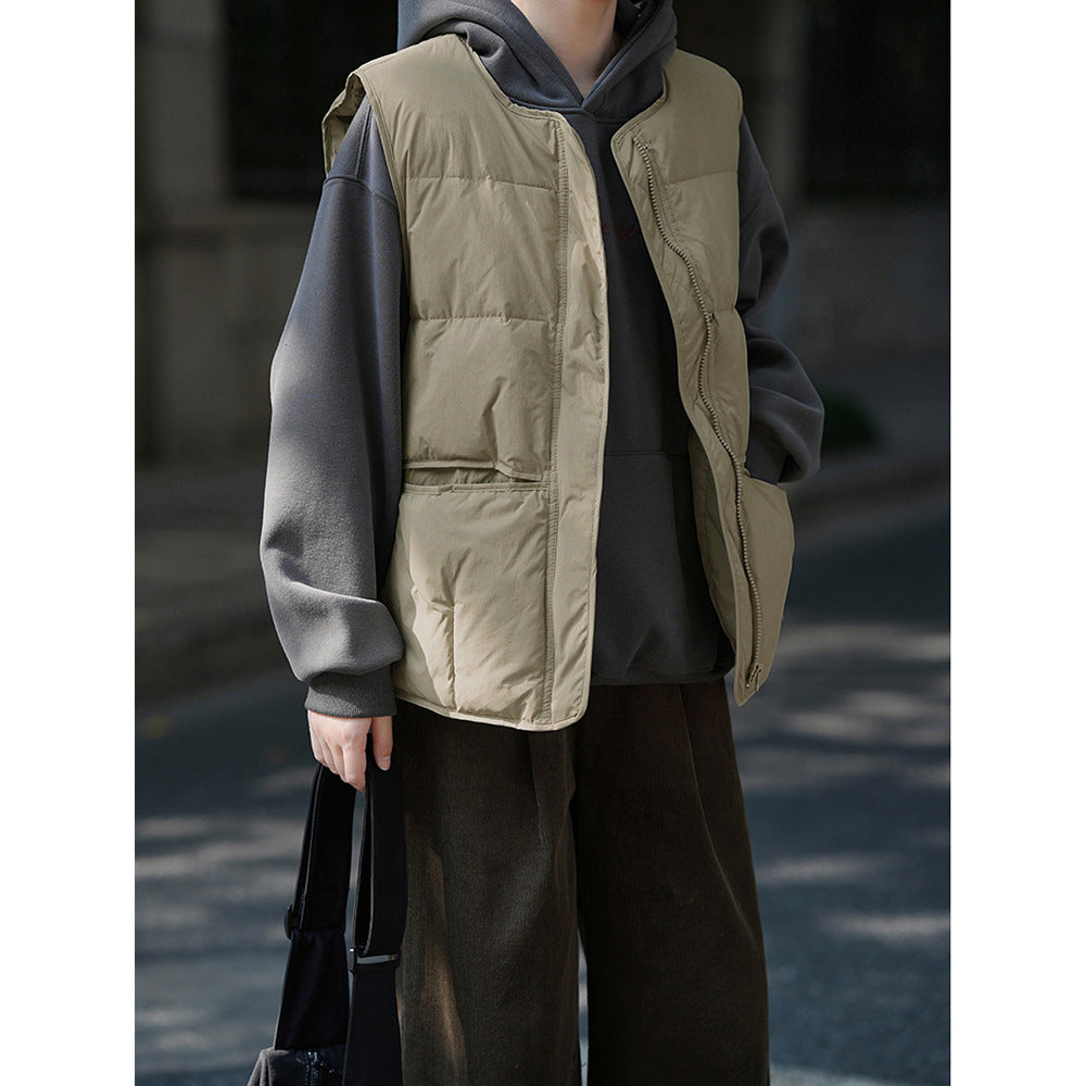 Beige quilted puffer vest over gray sweatshirt, stylish Korean winter fashion ملابس
