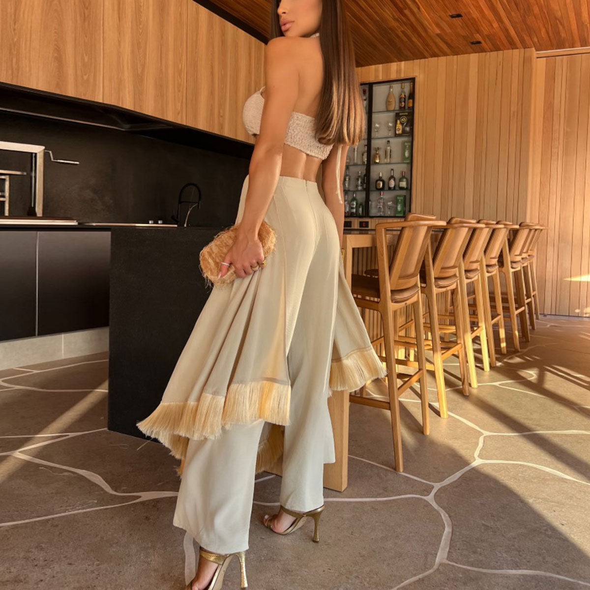 Woman in a stylish two-piece Stunning Lace up Split Jumpsuit, showcasing modern fashion ملابس