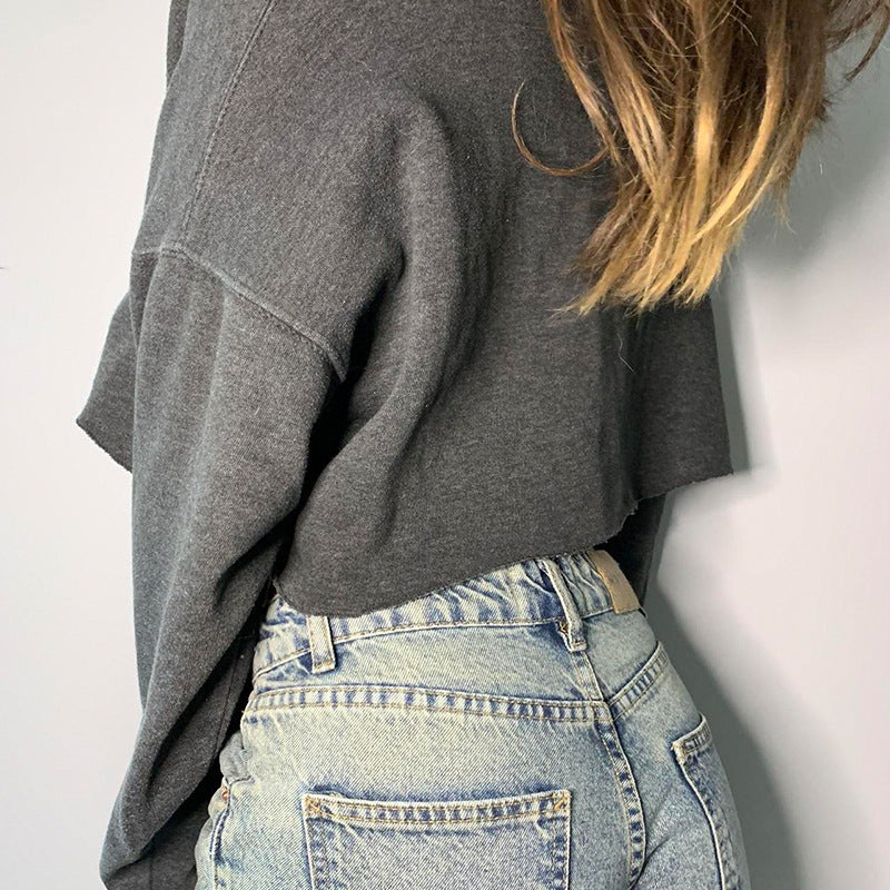 Cropped gray sweatshirt and light wash jeans from Langry’s Street Letter Graphic Print collection