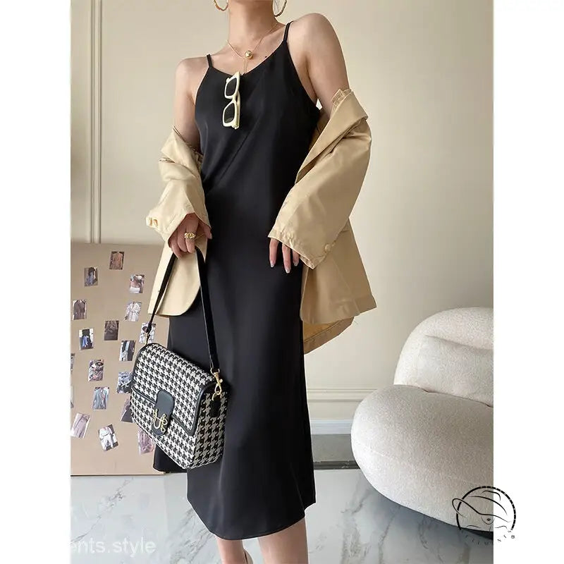Obsidian black acetate satin dress with thin straps and olive green houndstooth bag